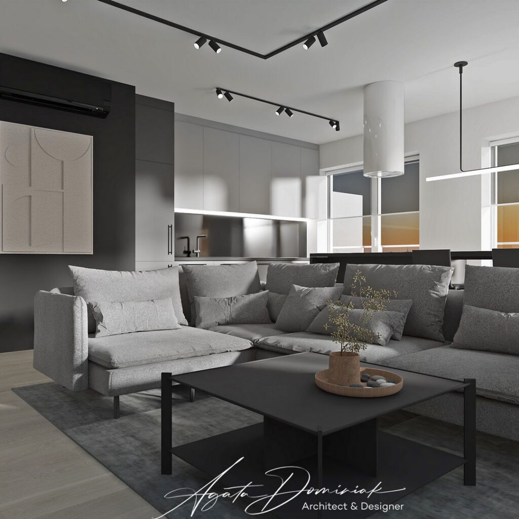 Salon z dużą szarą sofą i czarne ściany